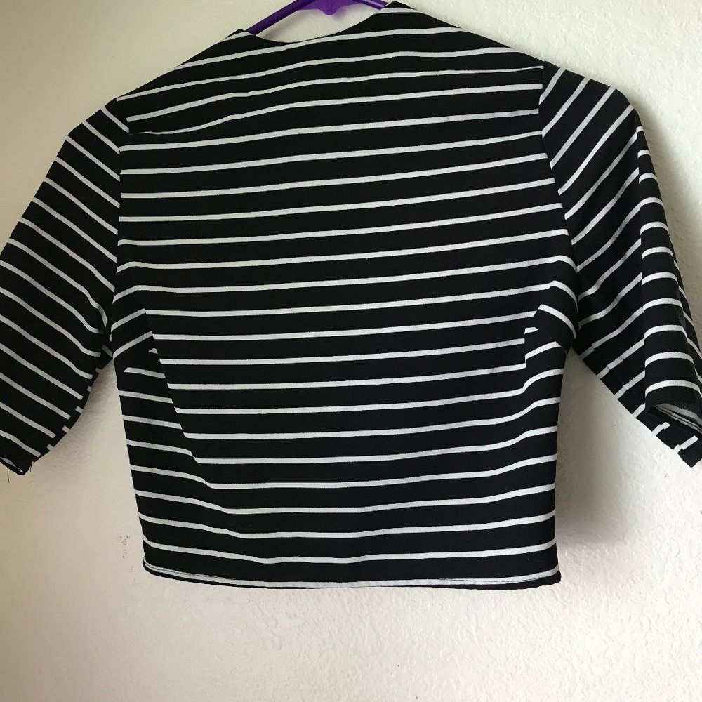 Black and white striped zip up shirt.